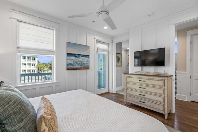 bedroom with ceiling fan, dark hardwood / wood-style flooring, and crown molding