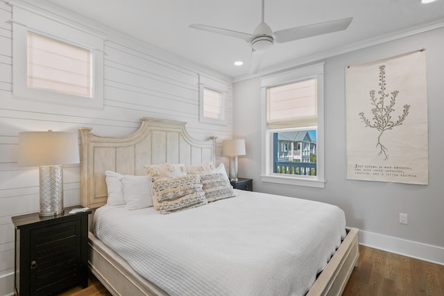 bedroom with ceiling fan, dark wood-type flooring, and crown molding