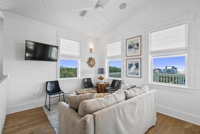 living room featuring vaulted ceiling, ceiling fan, and dark hardwood / wood-style floors