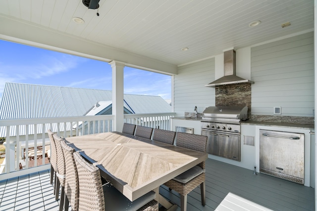 deck featuring exterior kitchen and grilling area