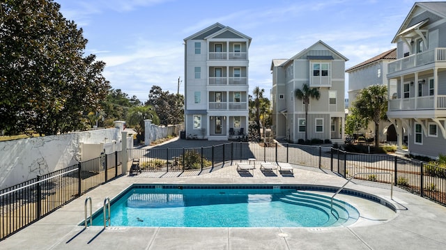 view of swimming pool with a patio area