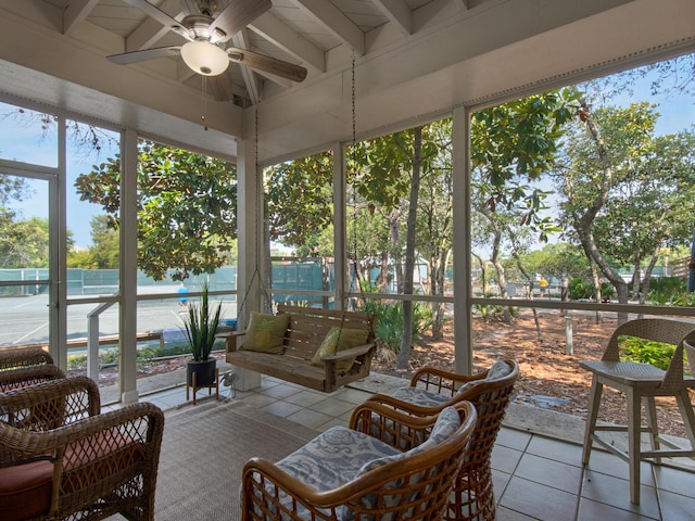 sunroom / solarium with plenty of natural light and beamed ceiling