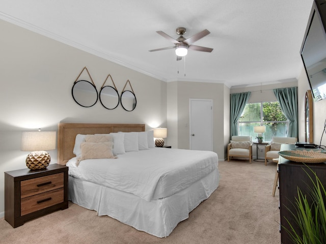 bedroom with ornamental molding, light colored carpet, and ceiling fan