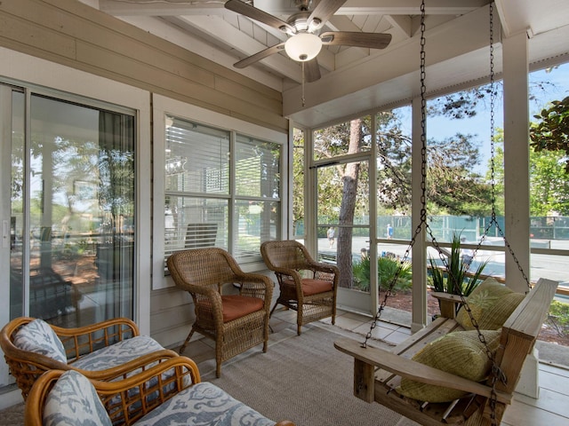 sunroom / solarium with ceiling fan