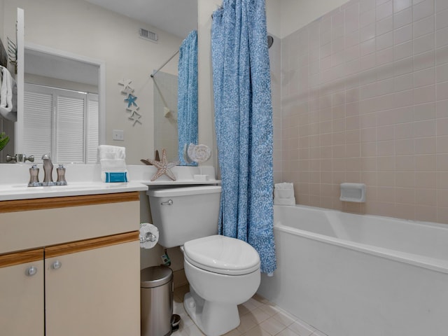 full bathroom with shower / tub combo, vanity, toilet, and tile patterned flooring