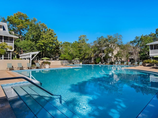 view of swimming pool featuring a pergola