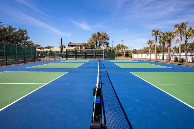 view of tennis court featuring basketball court