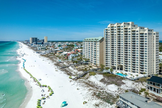 birds eye view of property with a view of the beach and a water view