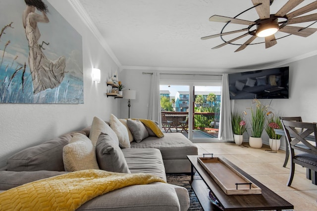 living room featuring light tile patterned floors, crown molding, and ceiling fan