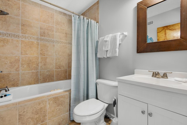 full bathroom featuring vanity, shower / tub combo with curtain, and toilet