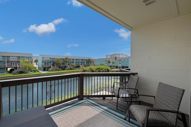 balcony featuring a water view