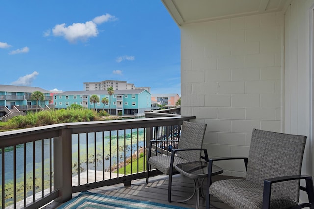 balcony featuring a water view