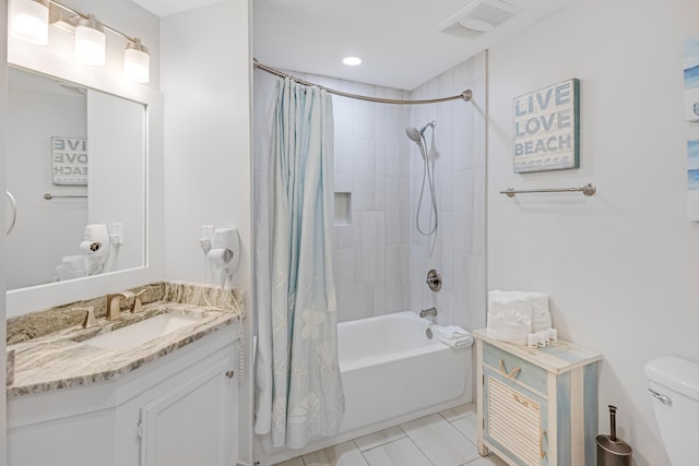 full bathroom with vanity, toilet, tile patterned flooring, and shower / tub combo