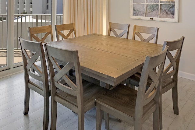 dining space with light wood-type flooring