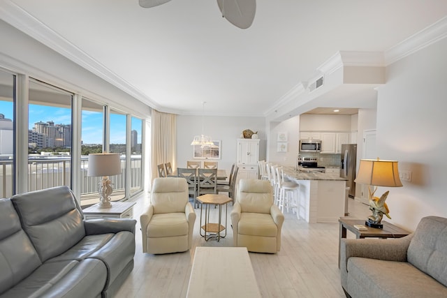 living room with crown molding and light hardwood / wood-style flooring