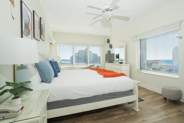 bedroom featuring ceiling fan and hardwood / wood-style flooring