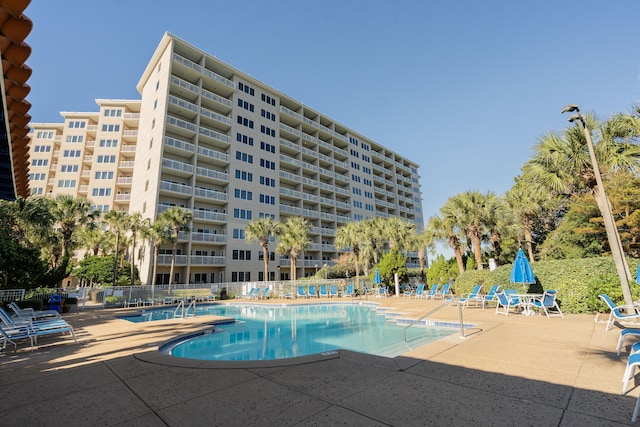 view of swimming pool featuring a patio area