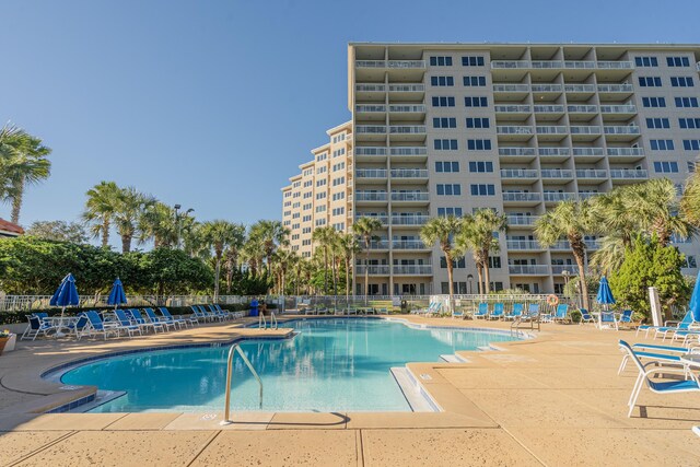 view of swimming pool featuring a patio area