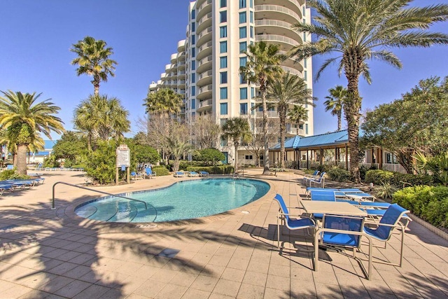 view of swimming pool with a patio