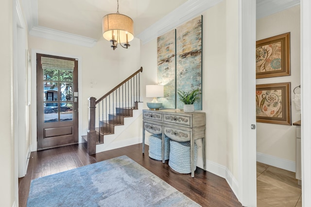 entryway with crown molding and dark hardwood / wood-style floors