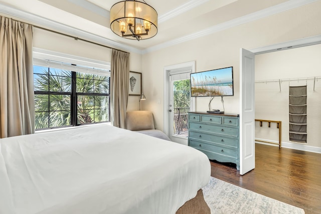 bedroom with multiple windows, crown molding, access to exterior, and a chandelier