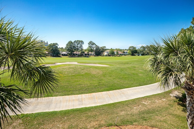 view of home's community with a lawn