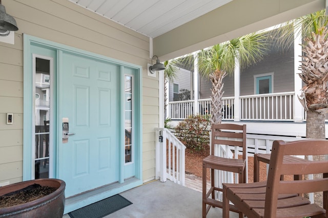 entrance to property with a porch