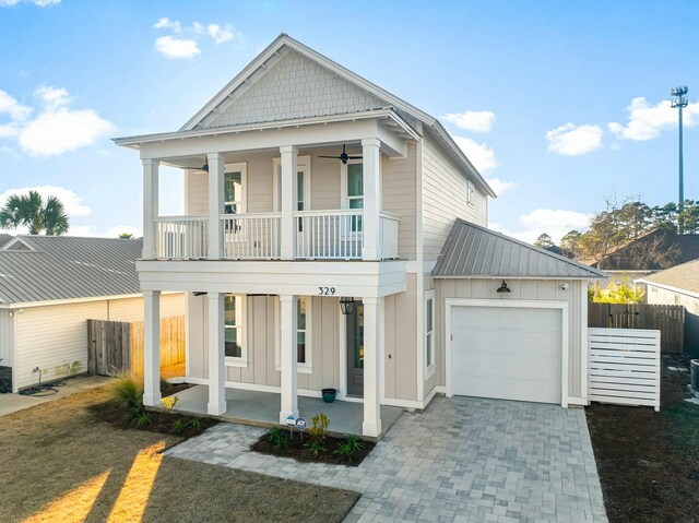 view of front of property with a porch, a garage, and a balcony