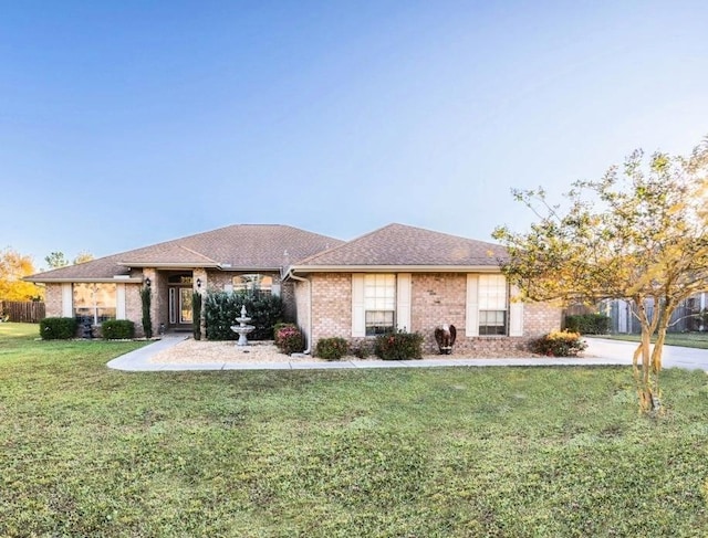 ranch-style house with a front yard