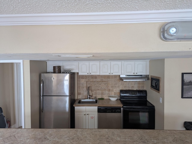 kitchen featuring sink, stainless steel appliances, white cabinets, and tasteful backsplash