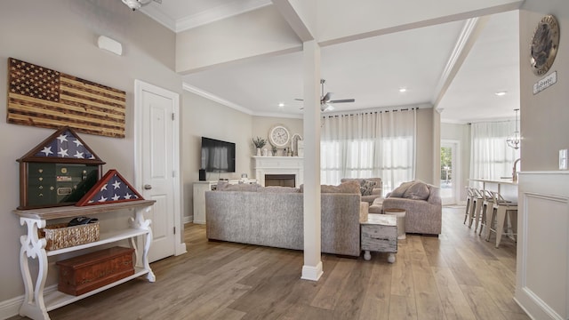 living room with hardwood / wood-style floors and ornamental molding