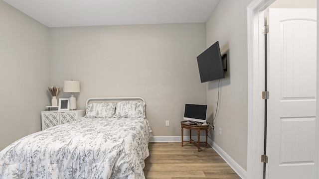 bedroom with light hardwood / wood-style flooring