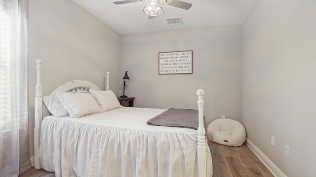 bedroom with hardwood / wood-style flooring and ceiling fan