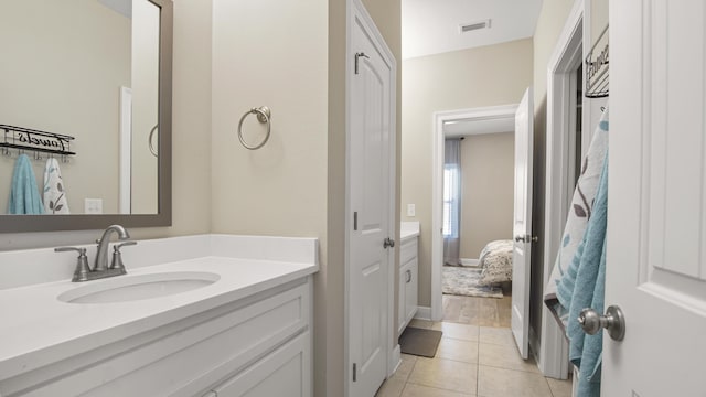 bathroom with vanity and tile patterned floors