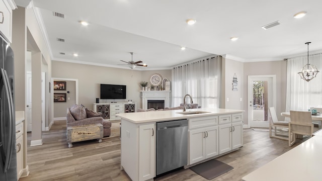 kitchen with sink, dishwasher, a kitchen island with sink, hanging light fixtures, and white cabinetry