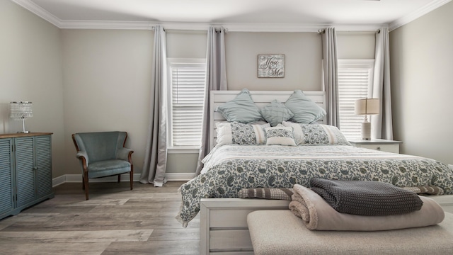 bedroom with crown molding and light hardwood / wood-style flooring