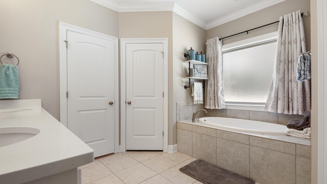 bathroom featuring ornamental molding, tile patterned floors, vanity, and tiled tub