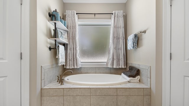 bathroom with a relaxing tiled tub