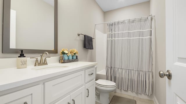 full bathroom featuring vanity, shower / bathtub combination with curtain, tile patterned floors, and toilet