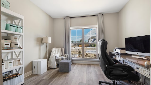 office space with light hardwood / wood-style flooring