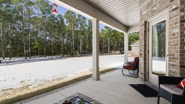 view of snow covered patio