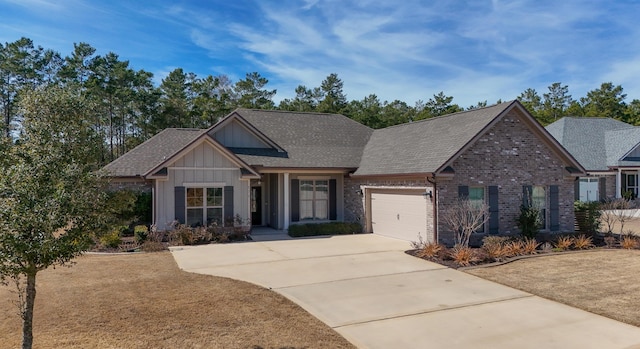 craftsman house featuring a garage and a front lawn