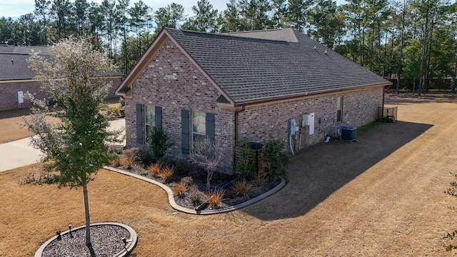 view of side of property featuring central AC unit