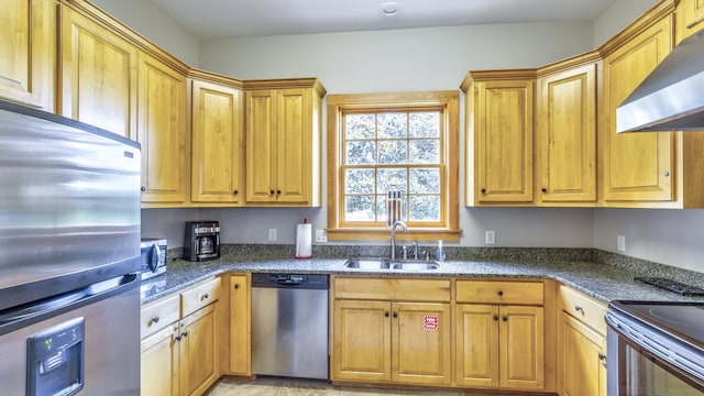 kitchen with dark stone countertops, sink, ventilation hood, and stainless steel appliances