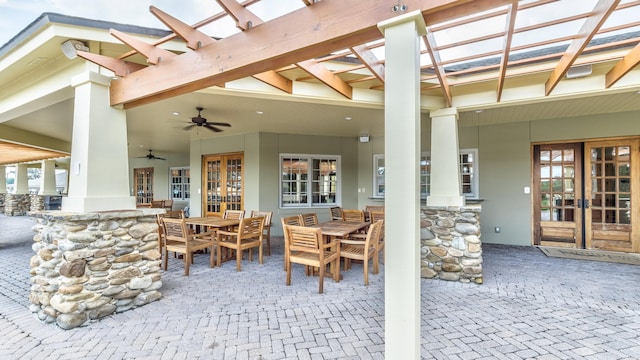 view of patio / terrace featuring a pergola, ceiling fan, and french doors