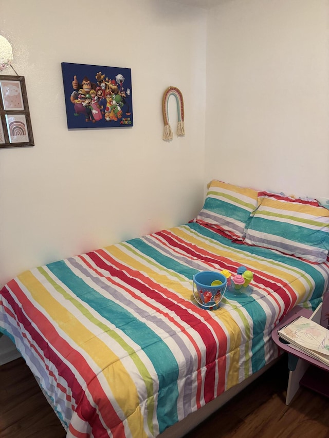 bedroom with wood-type flooring