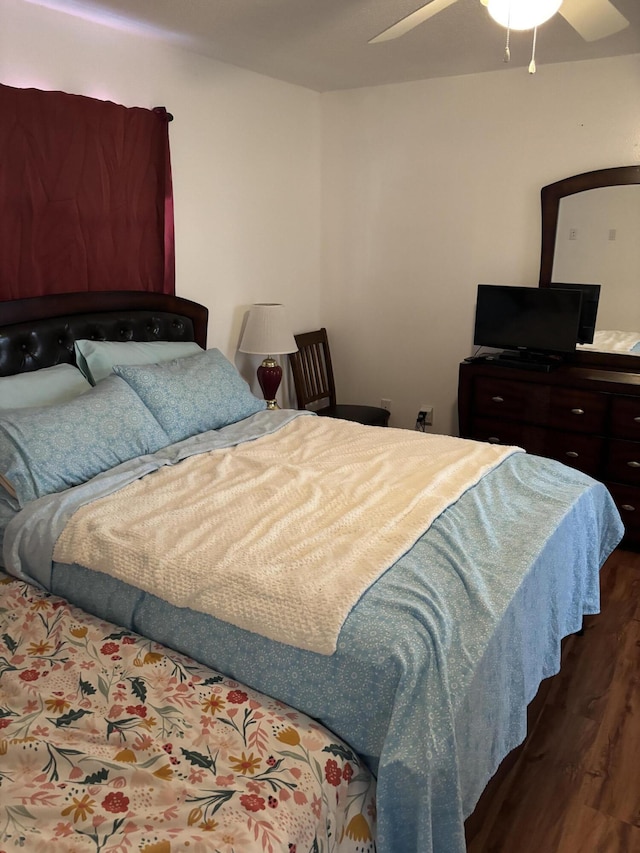 bedroom featuring dark hardwood / wood-style floors and ceiling fan