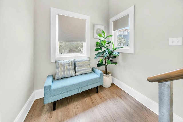 sitting room featuring plenty of natural light and light hardwood / wood-style floors