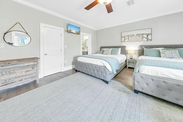 bedroom with ceiling fan, ornamental molding, ensuite bathroom, and hardwood / wood-style floors