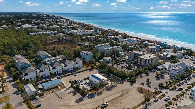 birds eye view of property featuring a view of the beach and a water view